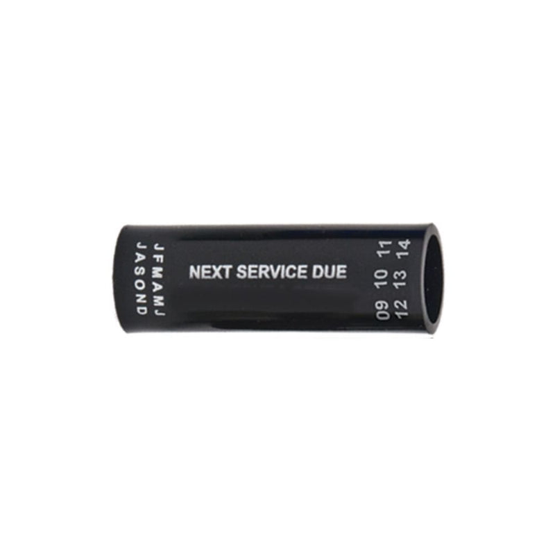 Black regulator hose tag with "NEXT SERVICE DUE" text and month/year markings – Innovative Scuba Concepts.
