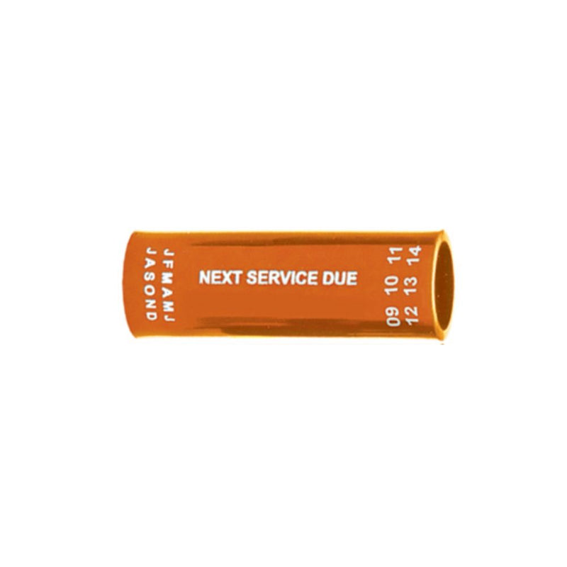 Orange regulator hose tag with "NEXT SERVICE DUE" text and month/year markings – Innovative Scuba Concepts.