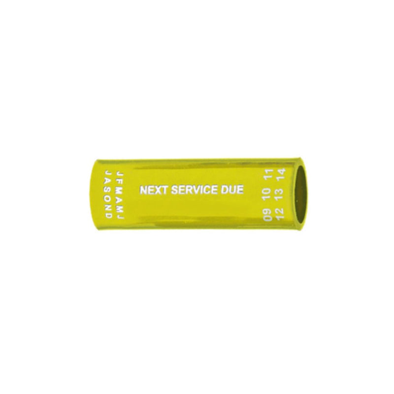 Yellow regulator hose tag with "NEXT SERVICE DUE" text and month/year markings – Innovative Scuba Concepts.