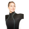 Woman wearing a black wetsuit with teal zipper on a white background