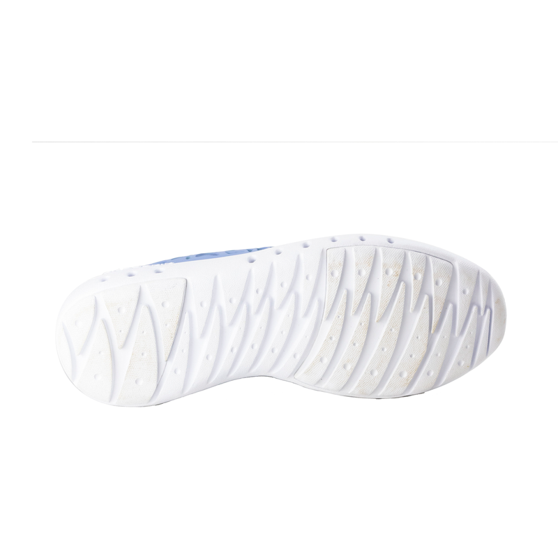 Bottom view of Crosskix Tetra Frost shoe displaying white textured outsole with drainage channels and grip pattern