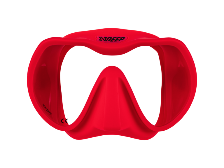 XDEEP red silicone low-profile dive mask with clear frame and red skirt, front view.