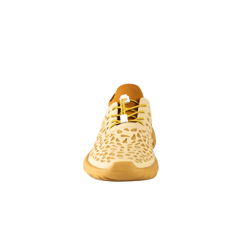 Front view of Crosskix Tetra Sand shoe in cream and golden yellow showing honeycomb perforated toe box and elastic toggle lacing system