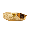 Top-down view of Crosskix Tetra Sand shoe showing interior insole, elastic toggle laces, and honeycomb perforated upper design in cream and golden yellow