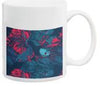 White ceramic mug with dark blue background featuring red and pink coral reef pattern design