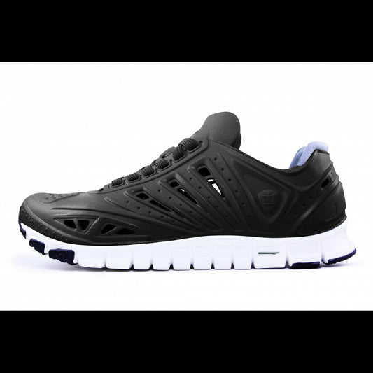 Crosskix APX Midnite athletic shoe side profile view showing black upper with perforated design details and white sole with purple accents