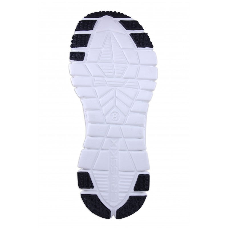 Crosskix APX Orangina outsole bottom view, displaying white rubber sole with black traction pods and geometric tread pattern