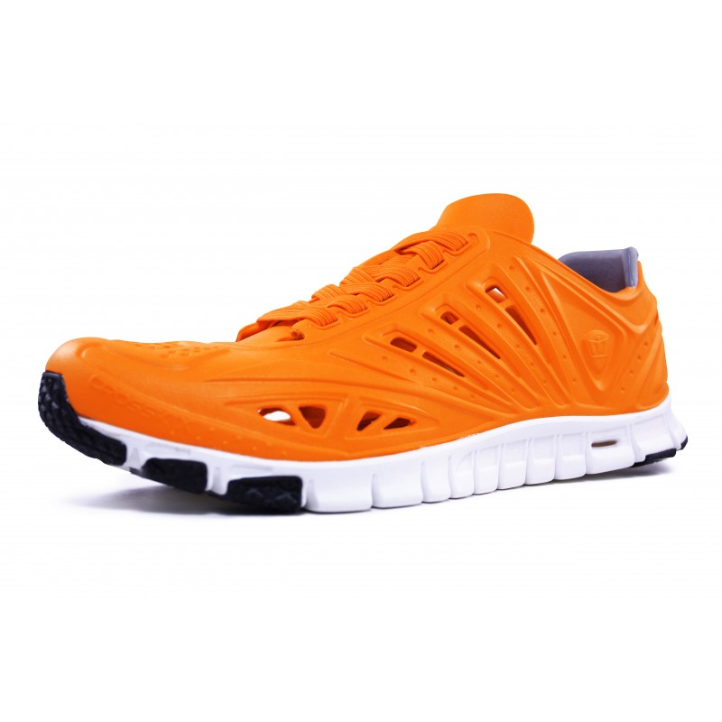 Crosskix APX Orangina sneaker viewed from left side profile, highlighting the orange synthetic upper with cut-out details and white midsole with black outsole elements