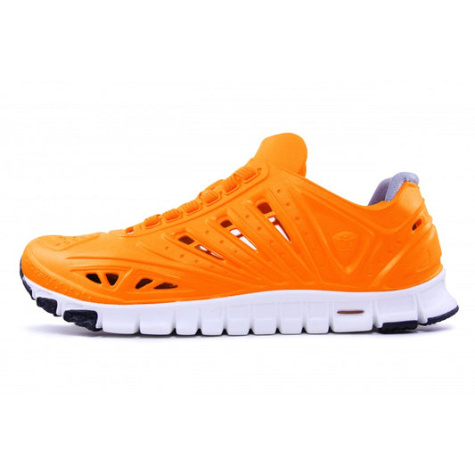 Crosskix APX Orangina athletic shoe shown from right side profile view, featuring bright orange upper with perforated design and white sole with black accents