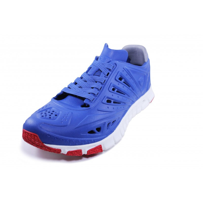 Crosskix APX Patriot blue sport shoe with mesh ventilation panels and red outsole details, three-quarter view