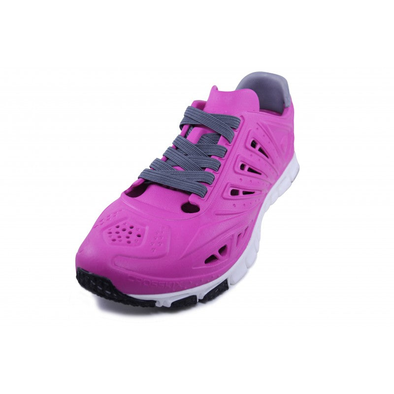 Crosskix APX Rose Azure shoe displayed at an angled front view, showcasing the pink upper with gray accents around the collar, gray laces, perforated ventilation design, and white outsole with black tread elements