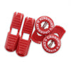 Crosskix elastic shoelace components laid out showing two red  lace clips and two circular Crosskix branded end caps with logo design