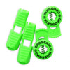 Crosskix elastic shoelace components laid out showing two green lace clips and two circular Crosskix branded end caps with logo design