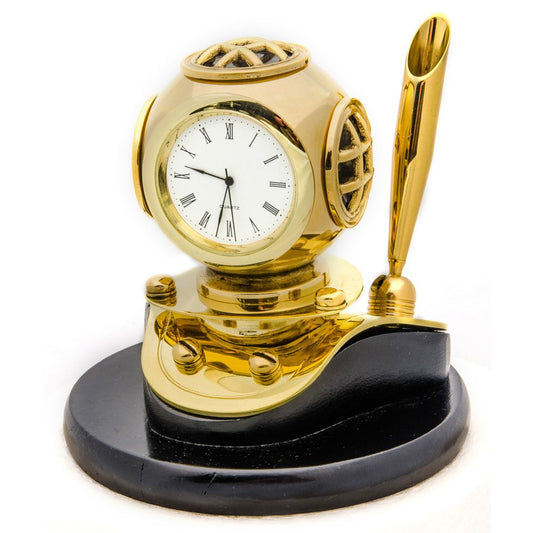 Brass diver helmet desktop clock with Roman numeral face and gold-tone pen holder, mounted on black base, from Innovative Scuba Concepts.