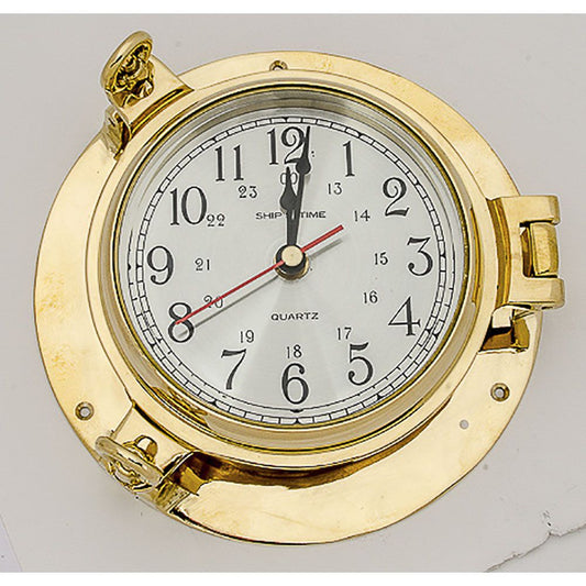 Classic ship’s time quartz clock with 24-hour markings, housed in a polished brass porthole-style frame with locking latch.