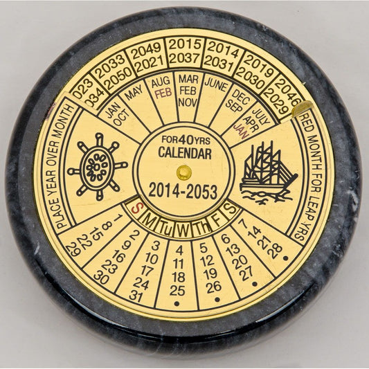 Round rotating brass calendar for the years 2014–2053, with engraved wheel and ship icons, ideal as a nautical desk accessory.