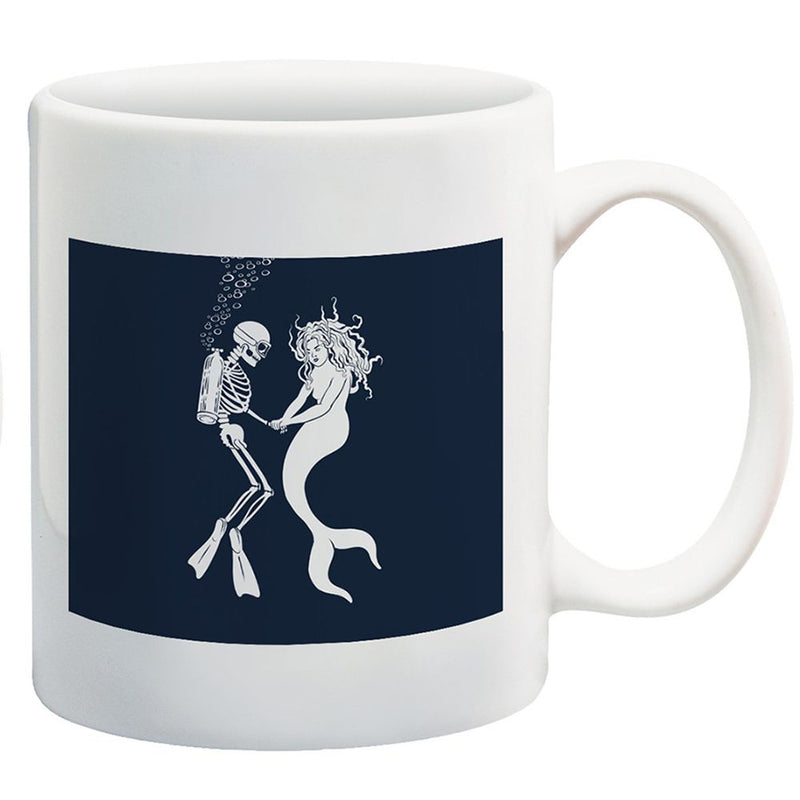 Skeleton scuba diver dancing with mermaid underwater with bubbles on dark blue background printed on white ceramic coffee mug