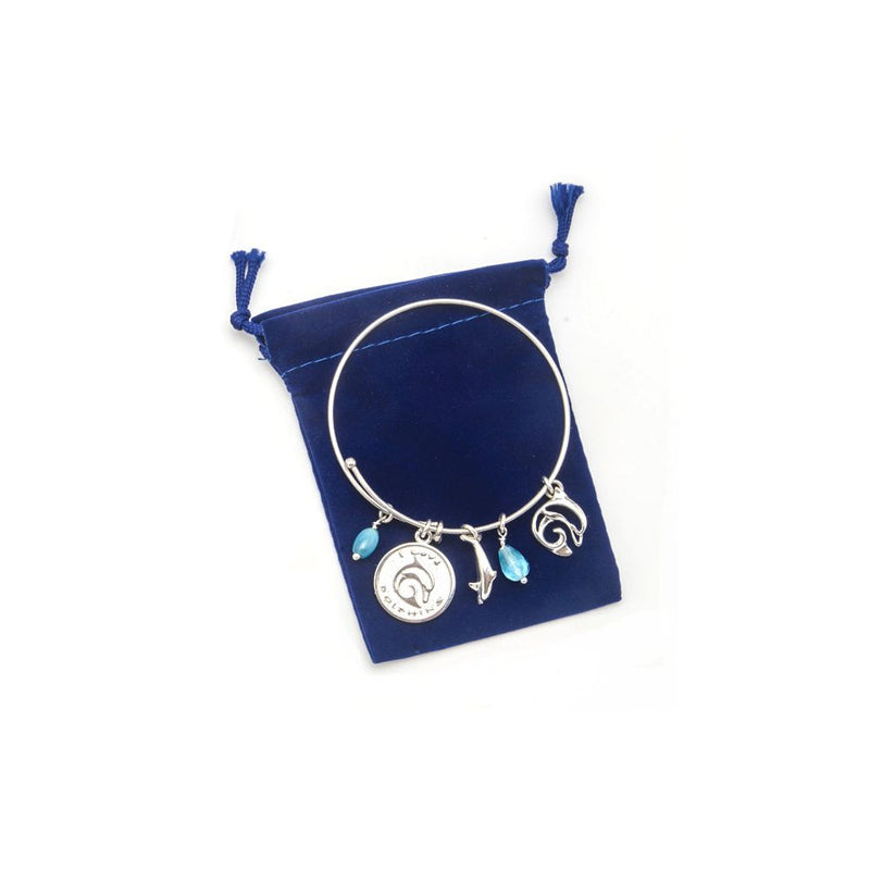 Innovate Scuba Concepts silver charm bracelet with whale and ocean-themed charms displayed in blue velvet bag
