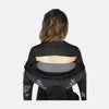 Person wearing a black back brace on a white background