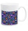 White ceramic mug with neon-style marine life illustrations on a dark blue background.