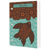 Dive log book with turquoise and orange cover showing decorative sea turtle with circular pattern design and swirl water motifs