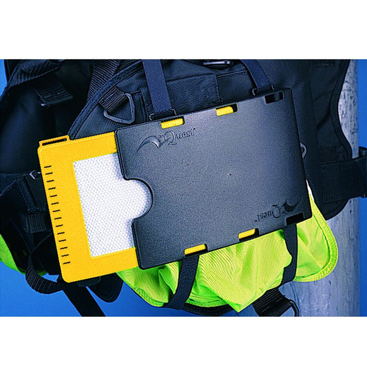 Diver wearing wetsuit and gloves holding yellow and gray underwater writing slates while diving