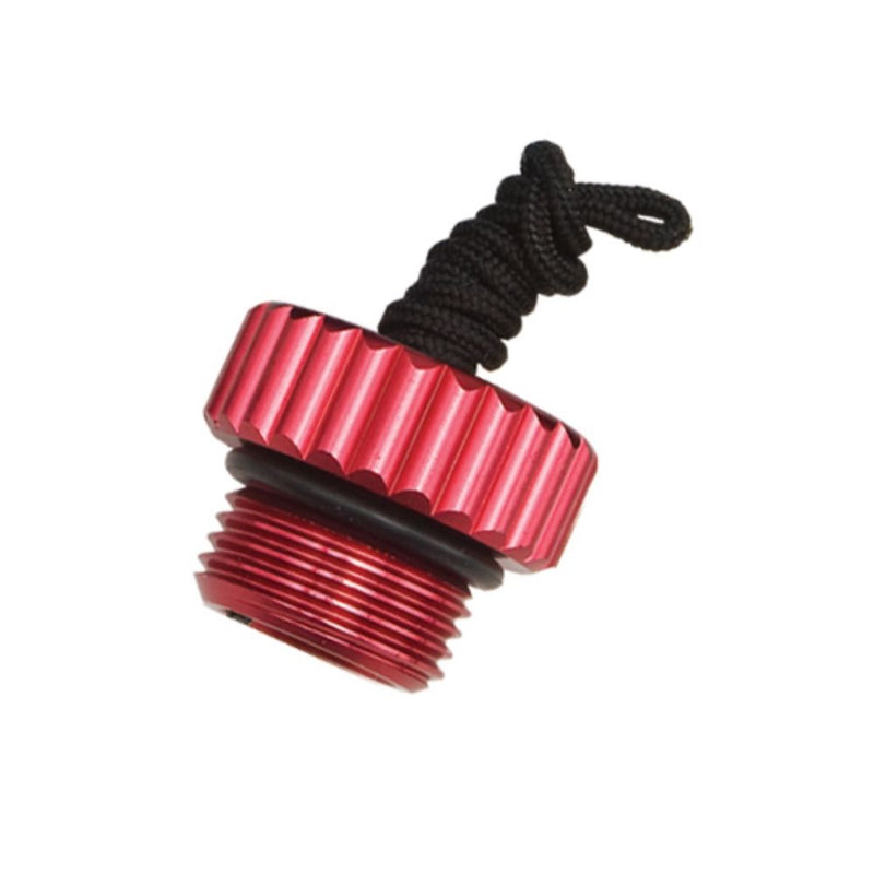 Innovative Scuba Concepts red anodized aluminum regulator dust cap with black retention cord and threaded male connection shown in profile view