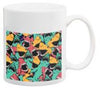 White ceramic mug with colorful tropical pattern featuring various diving and marine life elements in vibrant colors