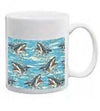 White ceramic mug with repeating shark attack illustrations over swirling turquoise water.