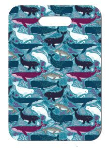 Innovate Scuba Concepts luggage tag with a repeating pattern of colorful whales swimming across a teal-blue ocean background.