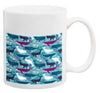 White ceramic mug with blue whale and marine life pattern design featuring multiple sea creatures